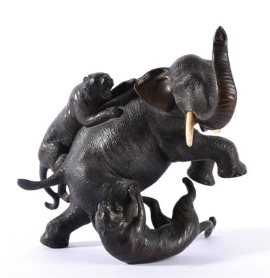 Lot 106 - A Japanese Bronze and Ivory Okimono, Meiji period, as an elephant being attacked by two tigers,...