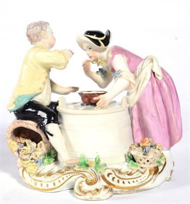 Lot 111 - A Chelsea Porcelain Figure Group of a Boy and Girl, circa 1755, she standing, he sitting on a...