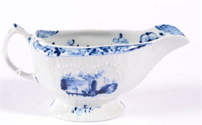 Lot 117 - A Lowestoft Porcelain Sauce Boat, circa 1770, painted in underglaze blue with chinoiserie...