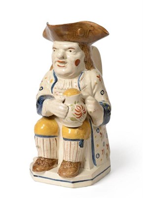 Lot 162 - A Pratt Type Pottery Toby Jug, circa 1810, of traditional form, seated holding a jug of ale,...