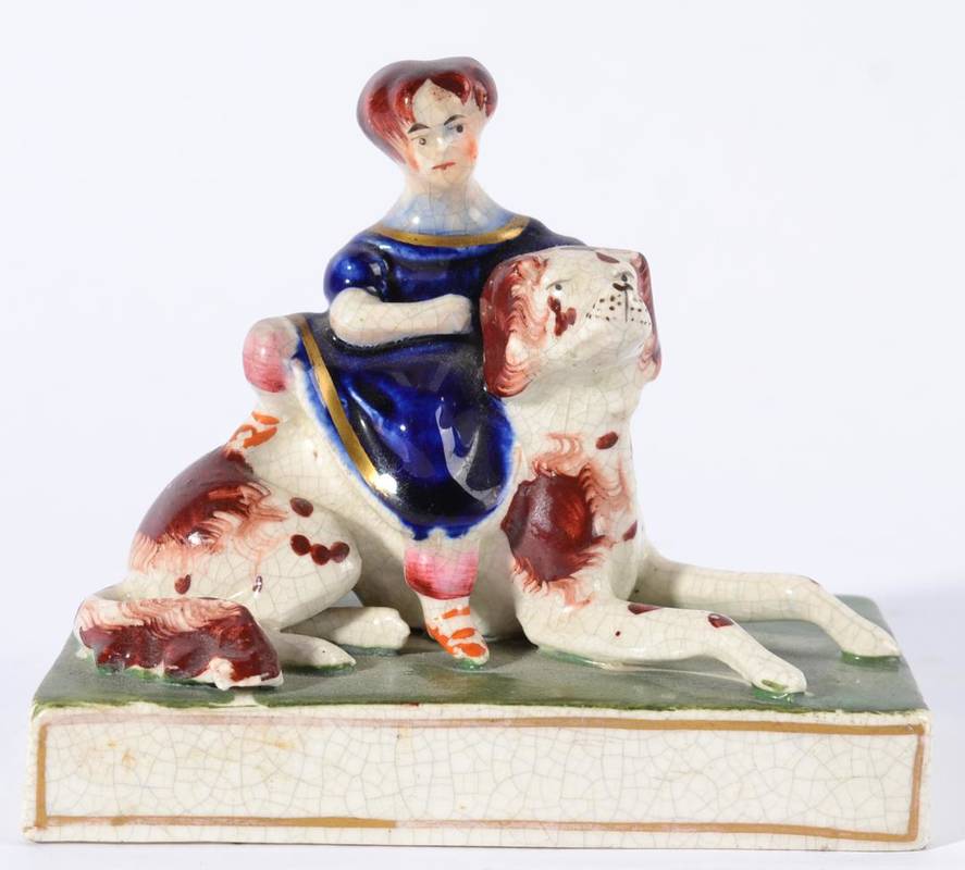 Lot 196 - A Staffordshire Pottery Figure of the Princess Royal, mid 19th century, sitting on a back of a...