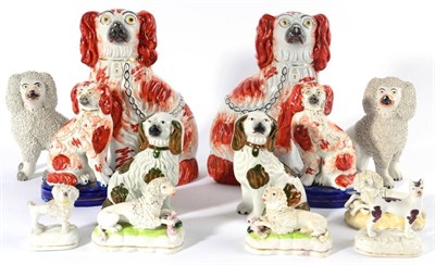 Lot 201 - A Pair of Staffordshire Pottery Figures of Recumbent Poodles, mid 19th century, with its paws...