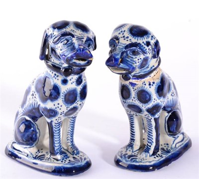 Lot 202 - A Pair of Delft Figures of Seated Hounds, late 19th century, naturalistically modelled and with...