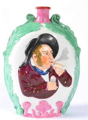 Lot 208 - A Pearlware Flask, 1st half 19th century, moulded and painted with a bust of a pipe smoker...