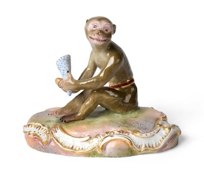 Lot 230 - A Meissen Porcelain Figure of a Monkey, late 19th century, sitting on a scroll moulded base holding
