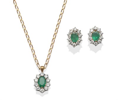 Lot 213 - An 18 Carat Gold Emerald and Diamond Cluster Pendant, the oval cut emerald within a border of round