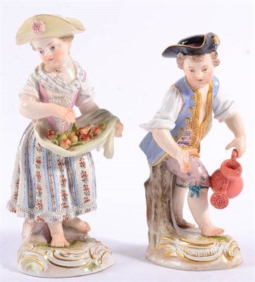 Lot 253 - A Pair of Meissen Porcelain Figures of Gardeners, late 19th century, both in 18th century dress, he