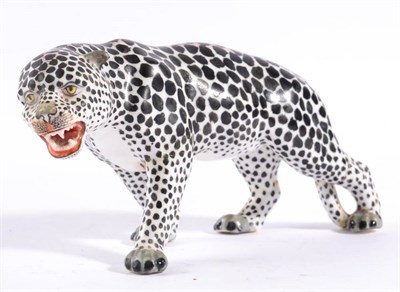 Lot 254 - A Meissen Style Porcelain Figure of a Snow Leopard, 19th century, naturalistically modelled and...