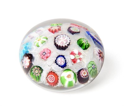 Lot 260 - A Clichy Spaced Millefiori Glass Paperweight, circa 1850, set with twenty individual canes on a...