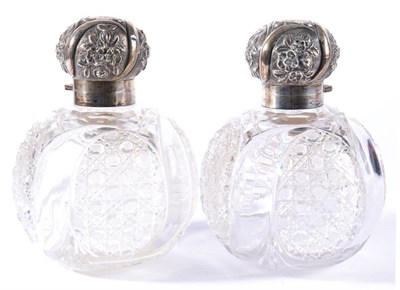 Lot 265 - A Pair of Late Victorian Silver Mounted Cut Glass Scent Bottles, London 1895, with geometric...