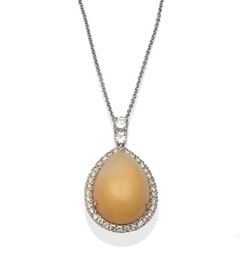 Lot 234 - An 18 Carat White Gold Opal and Diamond Pendant on Chain, a pear shaped cabochon opal within a...