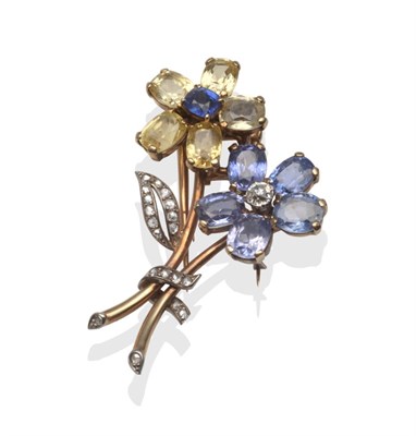 Lot 235 - A Sapphire and Diamond Flower Brooch, by Cartier, one flower set with a blue sapphire and...