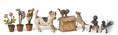 Lot 307 - An Austrian Cold Painted Bronze Group, cast as a cat on the roof of a kennel with a dog...