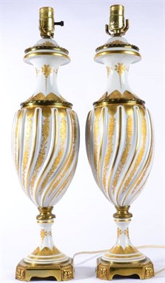 Lot 327 - A Pair of Gilt Metal Mounted SÂŠvres Style Porcelain Lamp Bases, 20th century, of wrythen...