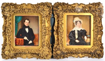 Lot 332 - English School (19th century): Miniature Portraits of a Lady and Gentleman, half length, in...