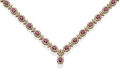 Lot 254 - ~ A Ruby and Diamond Necklace, oval cut ruby and round brilliant cut diamond clusters alternate...