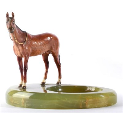 Lot 366 - An Austrian Cold Painted Figure of a Horse, 20th century, standing on an onyx ashtray, 15cm wide