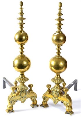 Lot 384 - A Pair of Brass Andirons, in 17th century style, of ball and blade knopped form on scroll cast...