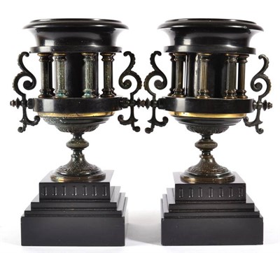 Lot 407 - A Pair of Gilt Metal Mounted Black Slate Urns, circa 1900, of twin-handled campana form, on stepped