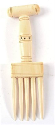 Lot 417 - A Zulu Ivory Hair Comb, with turned handle and five tines, 19cm long