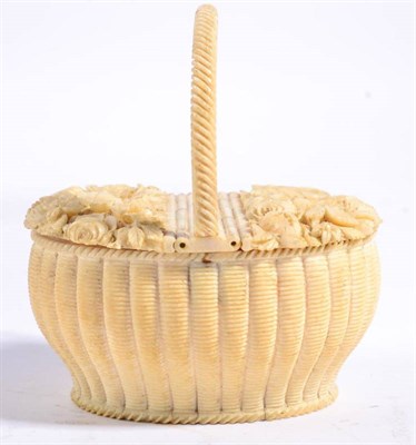 Lot 422 - A Dieppe Ivory Basket, late 19th century, of ribbed form with overhead handle and twin-hinged...