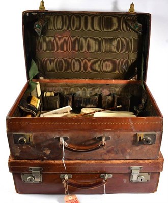 Lot 423 - A Leather Travelling Dressing Case, early 20th century, containing various ivory and ivory...