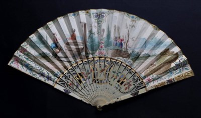 Lot 482 - An 18th Century Ivory Fan, with an unusual and elegant carved and pierced, painted and gilded...