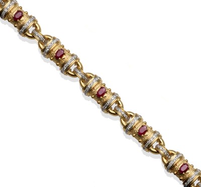 Lot 308 - ~ A Ruby and Diamond Bracelet, the links with a textured body, with bead details, an oval cut...