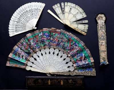 Lot 524 - A 19th Century Carved Ivory Mandarin Fan, Qing Dynasty, the guards deeply carved, and shaped at the