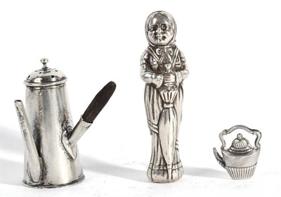 Lot 528 - A White Metal Cast Figural Scent Bottle, apparently unmarked, as a lady holding a parasol, with...