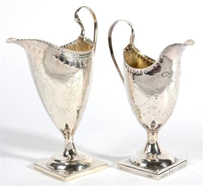 Lot 549 - Two Similar George III Silver Helmet Shaped Pedestal Cream Jugs, maker's mark WS, London 1789;...