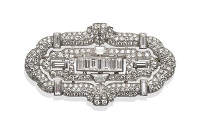 Lot 320 - ~ A Diamond Plaque Brooch, seven baguette cut diamonds channel set centrally, pavé set with...