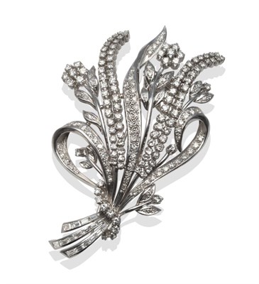 Lot 321 - ~ A Diamond Spray Brooch, set with round brilliant and baguette cut diamonds, as a ribbon tied...