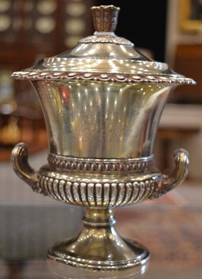 Lot 585 - A Silver Gilt Trophy Cup and Cover, Edward Barnard & Sons, London 1933, of campana form,...