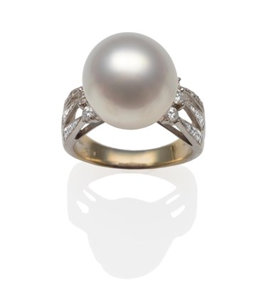 Lot 326 - A Cultured South Sea Pearl and Diamond Ring, the pearl set over diamond set forked shoulders,...