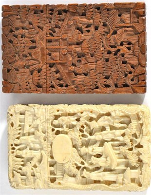 Lot 597 - A Chinese Carved Ivory Card Case, 19th century, with pull off cover, decorated all over with a...