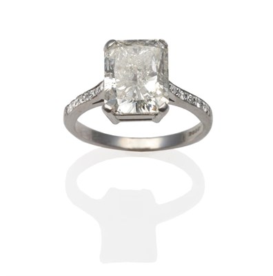 Lot 327 - An 18 Carat White Gold Diamond Solitaire Ring, the radiant cut diamond in a four claw setting, with