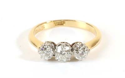 Lot 644 - A Diamond Three Stone Ring, graduated old cut diamonds in claw settings, to knife edge...