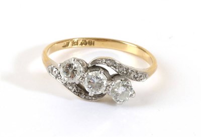 Lot 653 - A Diamond Three Stone Ring, round brilliant cut diamonds in claw settings, to diamond set...