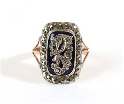 Lot 657 - A Georgian Marcasite and Blue Enamel Ring, an oblong plaque with applied marcasite floral...