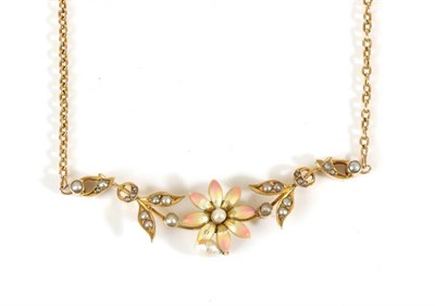 Lot 669 - An Early Twentieth Century Seed Pearl and Enamel Necklace, a flower head with a central seed...