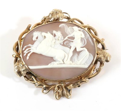 Lot 681 - A Victorian Cameo Brooch, depicting Peace halting the horses of Mars, in a vine motif frame,...