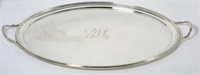 Lot 405 - A George III Silver Tray, William Bennett, London 1804, oval with twin handles and a plain...