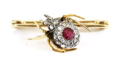 Lot 690 - A Ruby and Diamond Spider Brooch, the abdomen inset with an oval cut ruby within a cluster of...