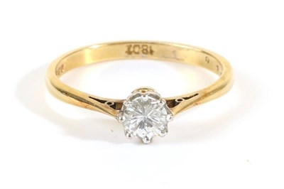 Lot 699 - An 18 Carat Gold Solitaire Diamond Ring, a round brilliant cut diamond in a claw setting, to...