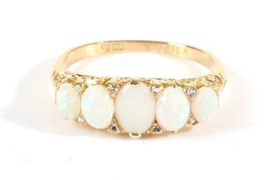 Lot 700 - A Victorian 18 Carat Gold Opal and Diamond Ring, five graduated oval cabochon opals, spaced by...