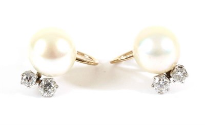 Lot 701 - A Pair of Cultured Pearl and Diamond Earrings, a cultured pearl flanked by two graduated old...