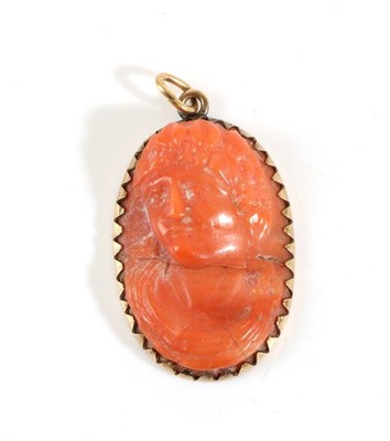 Lot 706 - A Circa 1800 Coral Cameo Pendant, depicting the bust of a Bacchant, measures 4cm by 2.5cm