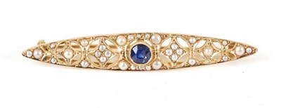 Lot 707 - An Early 20th Century Sapphire and Seed Pearl Brooch, a round cut sapphire in a milgrain...