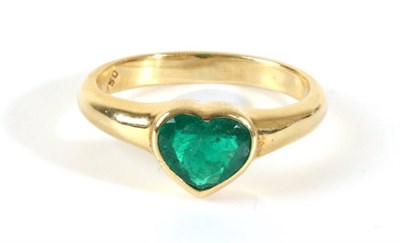 Lot 712 - An Emerald Ring, a heart-cut emerald in a rubbed over setting, to a tapering shank, finger size Q